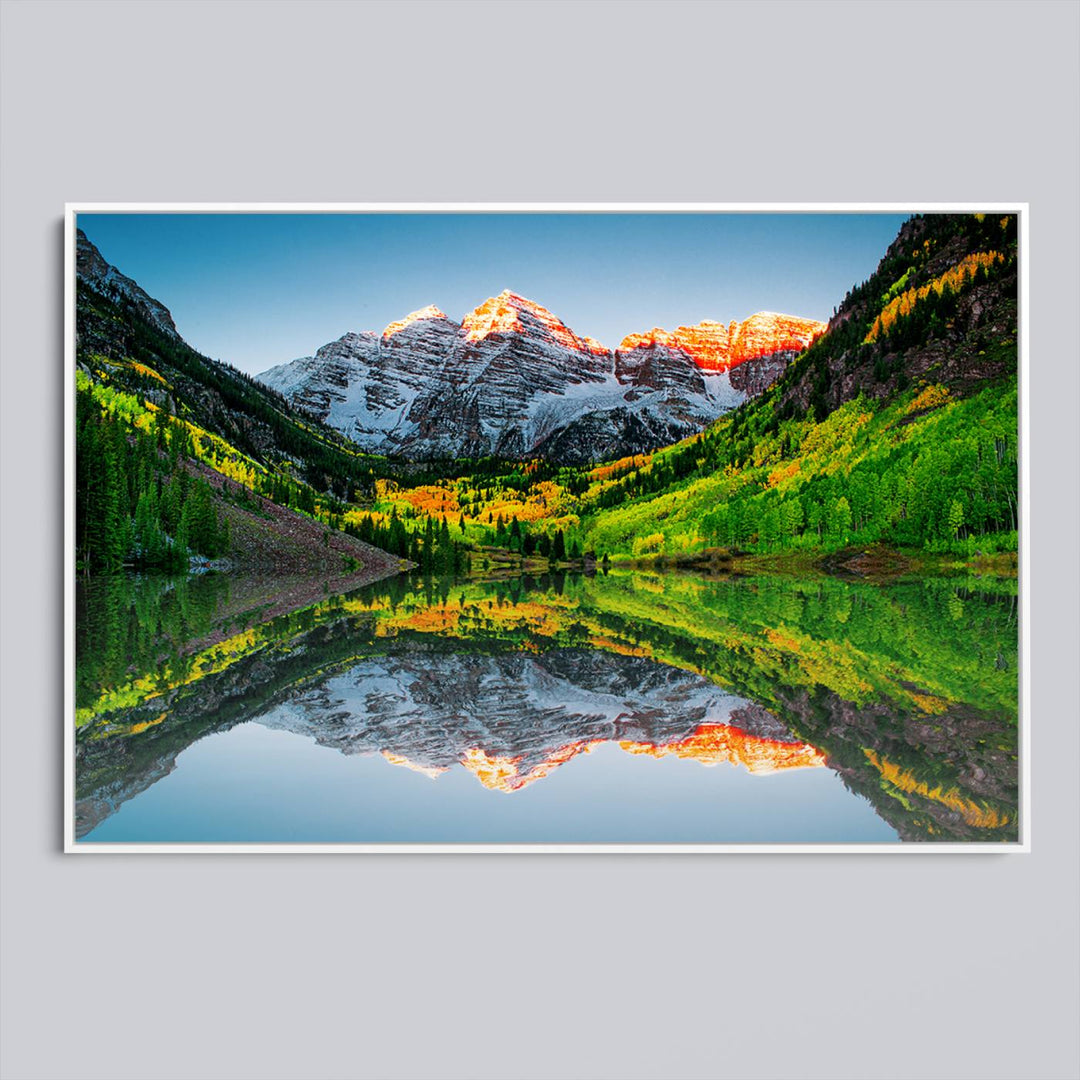 The Sunrise Maroon Bells Lake Wall Art Print beautifully captures North Maroon Peak mirrored in the tranquil lake, framed by lush greenery.