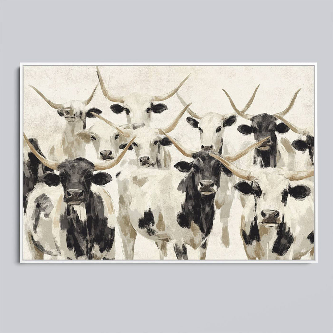 Canvas print titled Longhorn Texas Cow Drawing, depicting longhorn cattle with black and white markings, made in the USA, displayed on the wall.