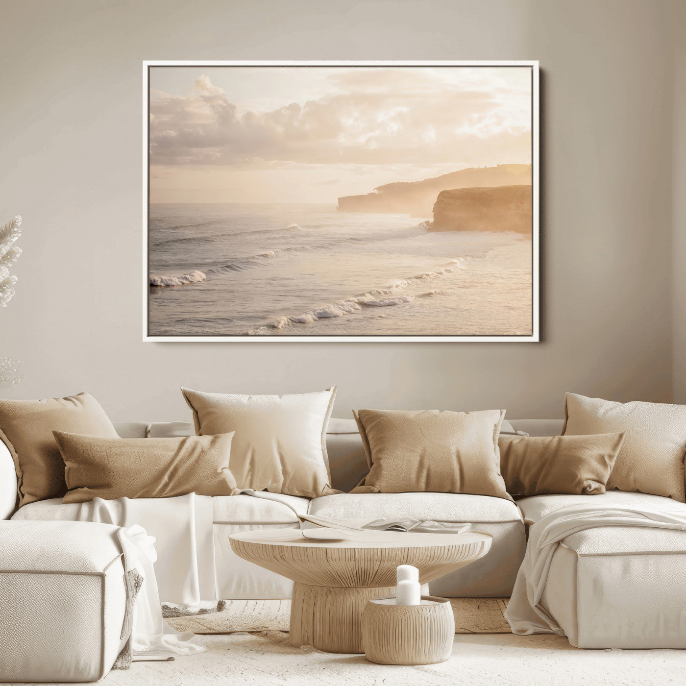 Golden hour seascape with misty cliffs and gentle waves rolling towards the shore, capturing a tranquil and warm coastal atmosphere.
