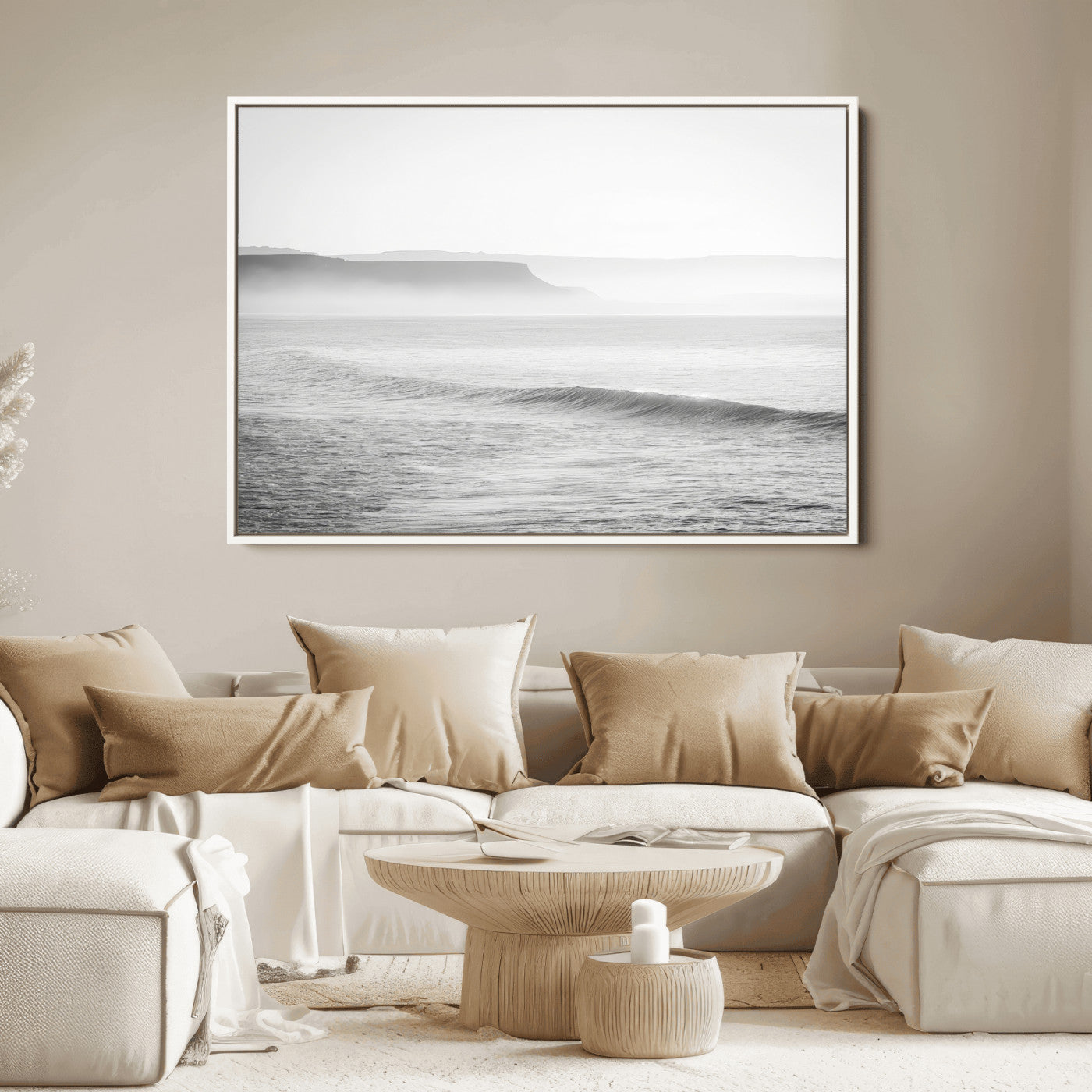 A black and white minimalist seascape featuring soft rolling waves and misty distant cliffs, creating a serene and timeless coastal atmosphere.