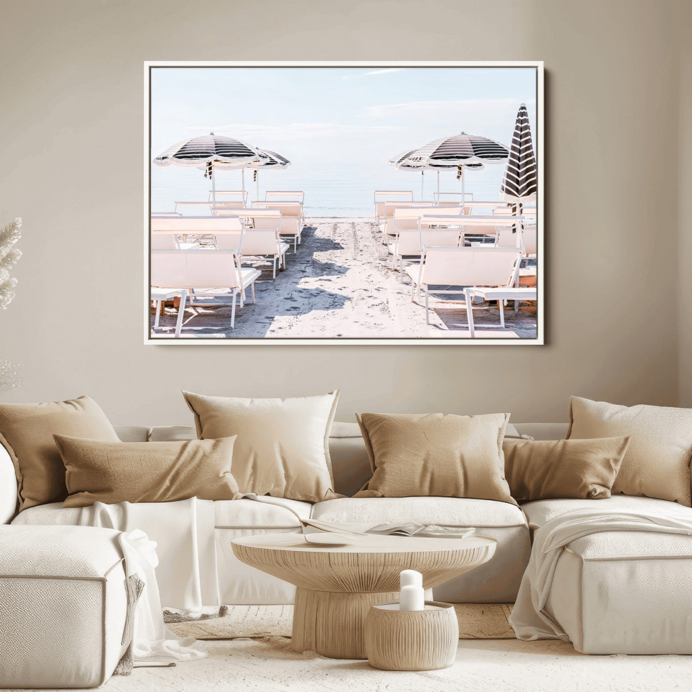 A serene minimalist beach scene featuring striped umbrellas, soft pastel sand, and an elegant lounge setup, creating a tranquil and stylish coastal retreat.