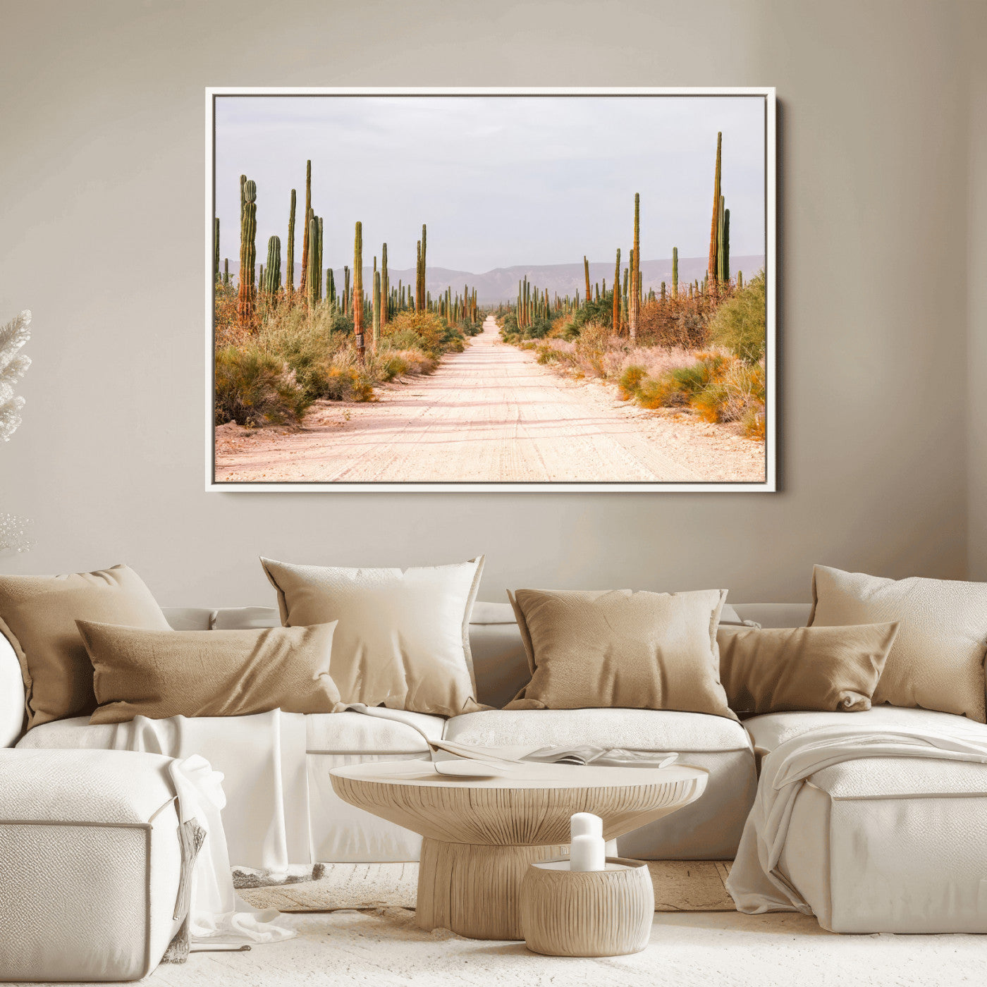A desert road lined with saguaro cacti under a golden sky, creating a warm southwestern feel, perfect for boho or rustic decor.