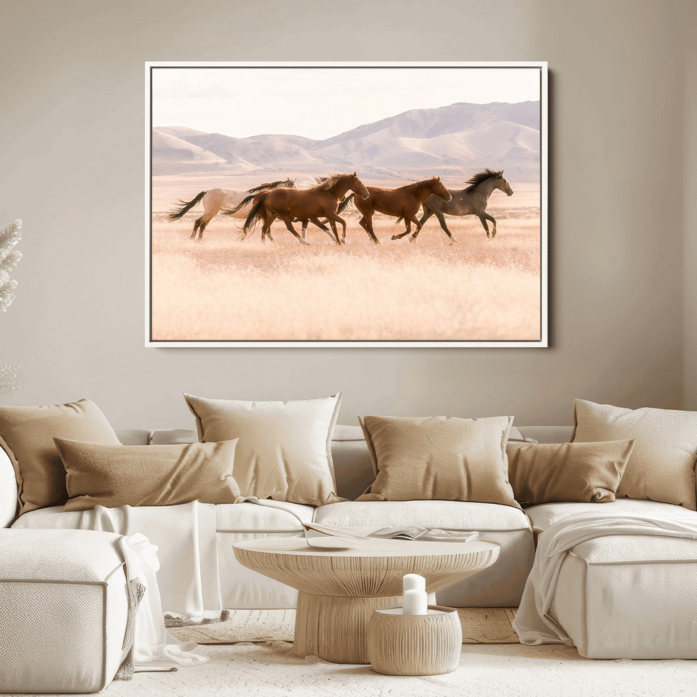 A herd of wild horses galloping through a sunlit desert plain with mountains in the background, perfect for rustic or western-themed wall decor.