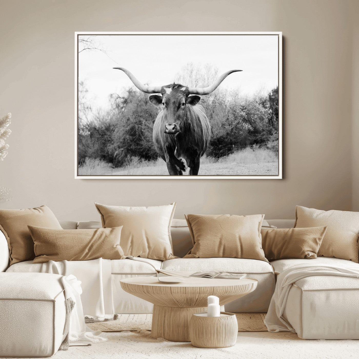 Black and white photo of a Longhorn cow facing camera, ideal for rustic, farmhouse, or western-themed home wall decor.