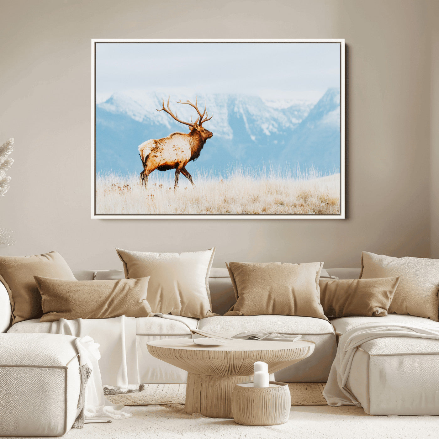 Majestic elk standing on dry grassland with snowy mountains in the background, ideal for rustic or lodge-inspired wall decor.
