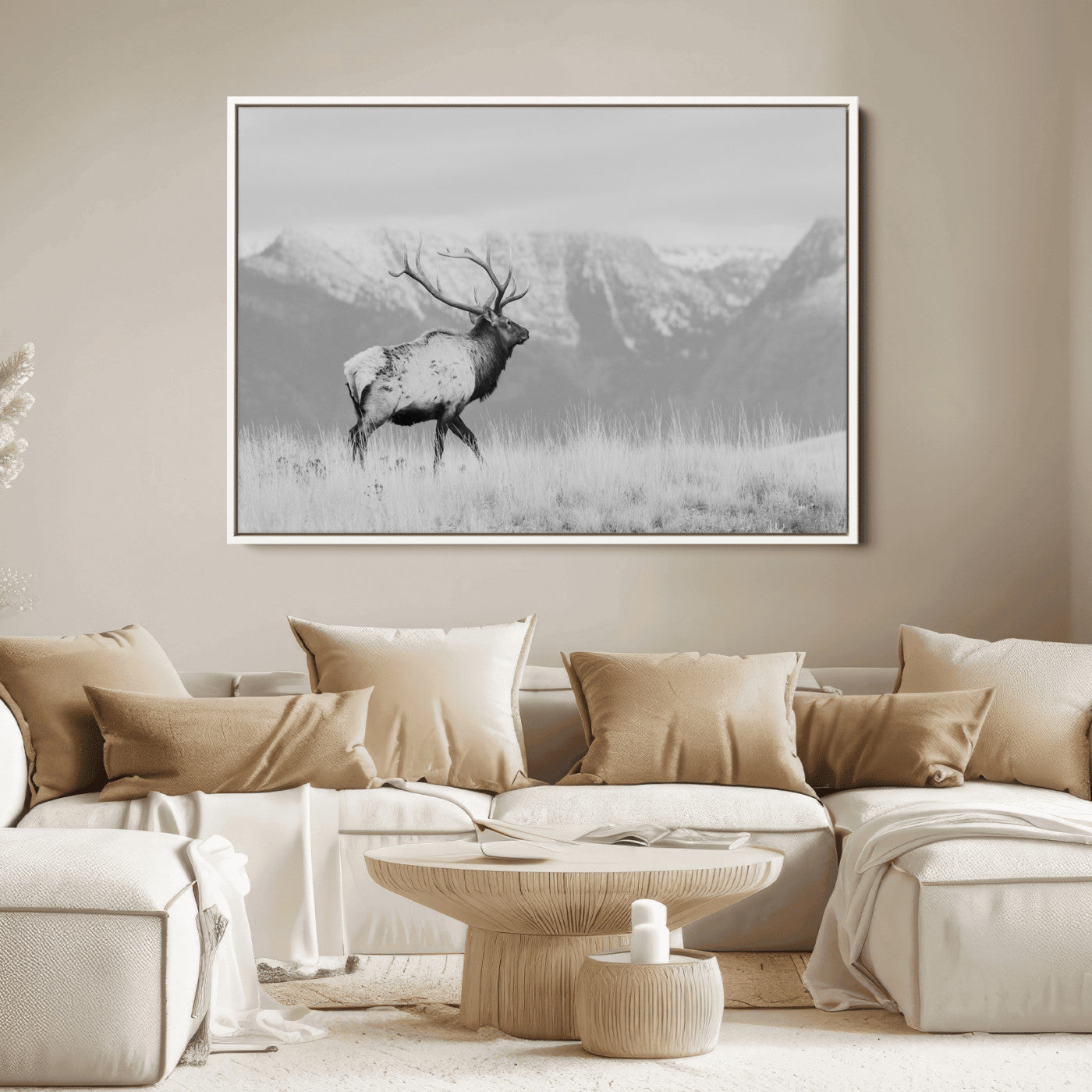 Black and white elk standing in front of snowy mountain range, perfect for rustic lodge or nature-inspired wall decor.
