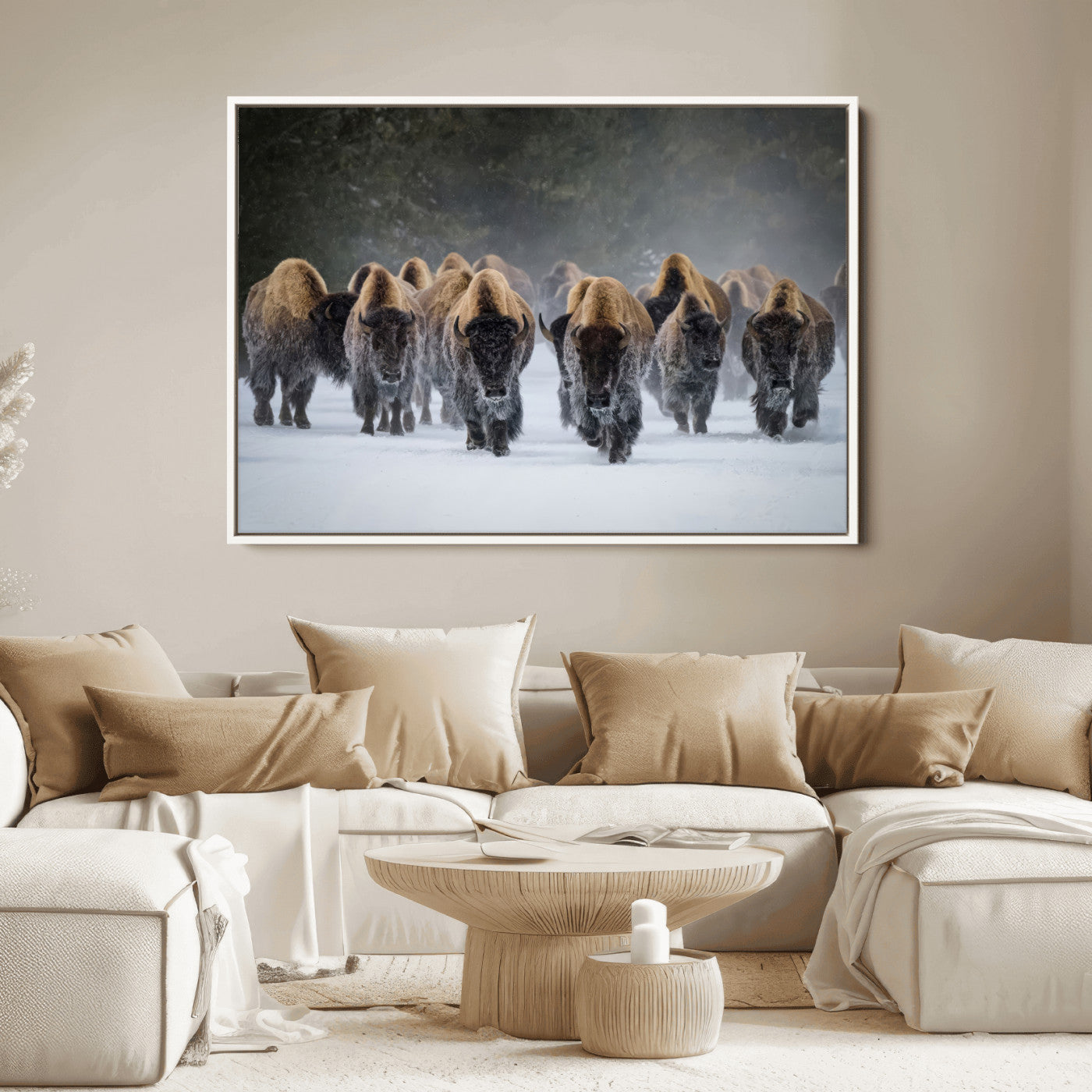 A herd of American bisons walking through deep snow in a forest, evoking a powerful rustic wilderness mood for western-style interiors.