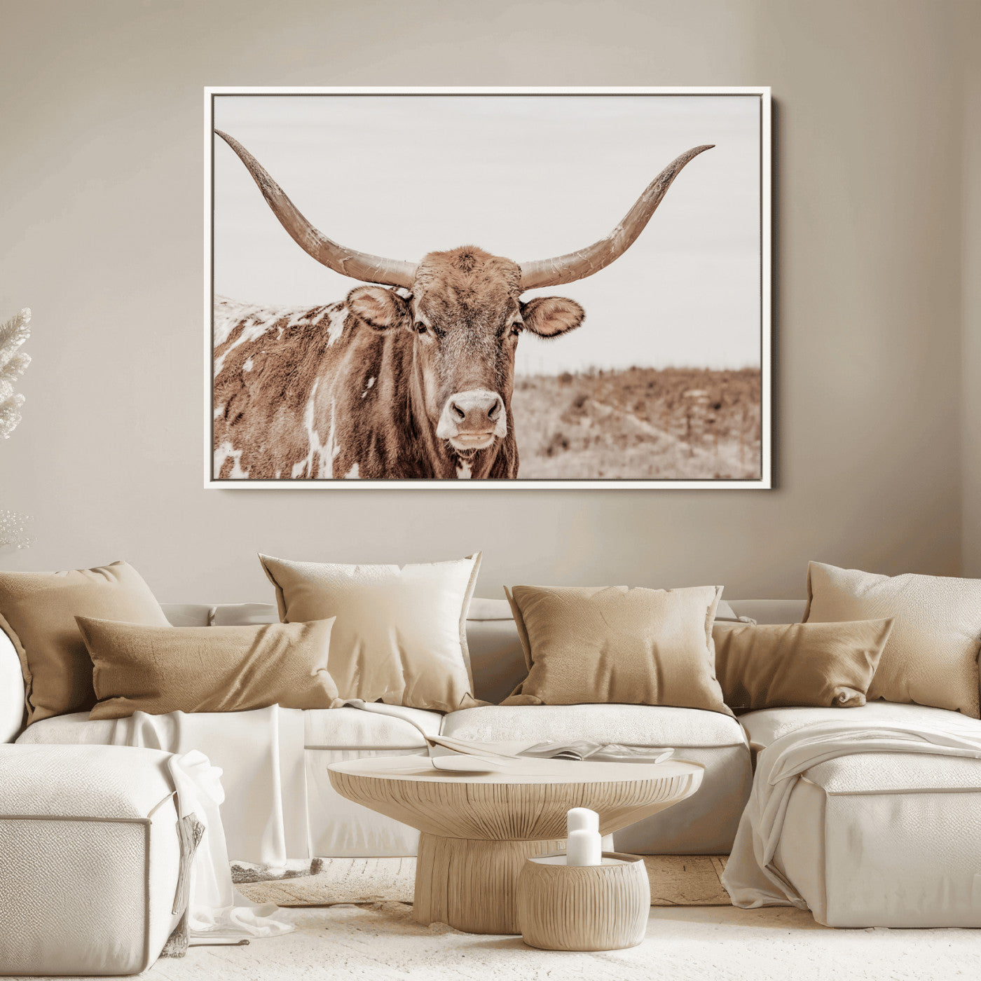A longhorn cow in soft beige desert tones, standing calmly in open land, perfect for neutral western or rustic farmhouse interiors.