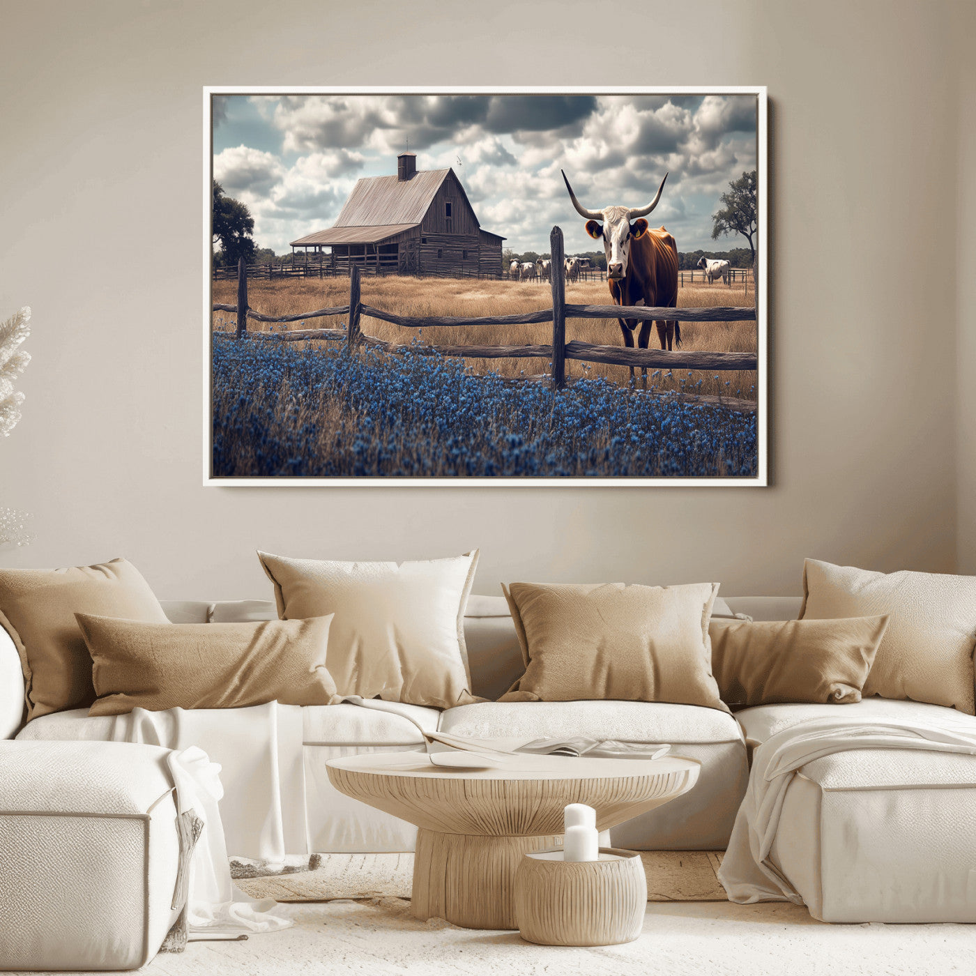 Framed canvas art of a Texas Longhorn cow near a rustic barn and bluebonnet field, ideal for country-style or farmhouse wall decor.