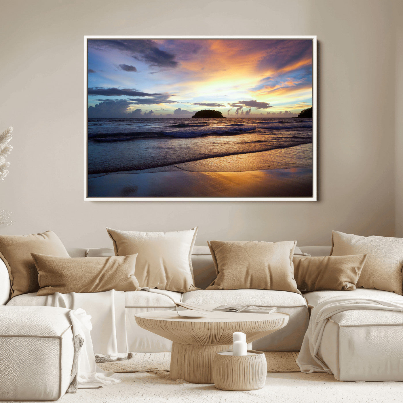 A tropical beach at sunset with waves gently washing ashore, reflecting golden and purple hues in the sky, creating a tranquil coastal scene.