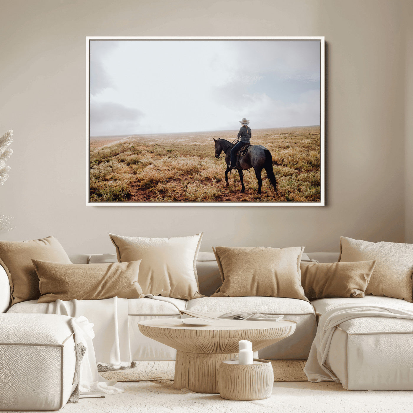 A lone cowboy riding horseback across an open prairie under a vast sky, capturing the rugged and timeless spirit of the Western frontier.
