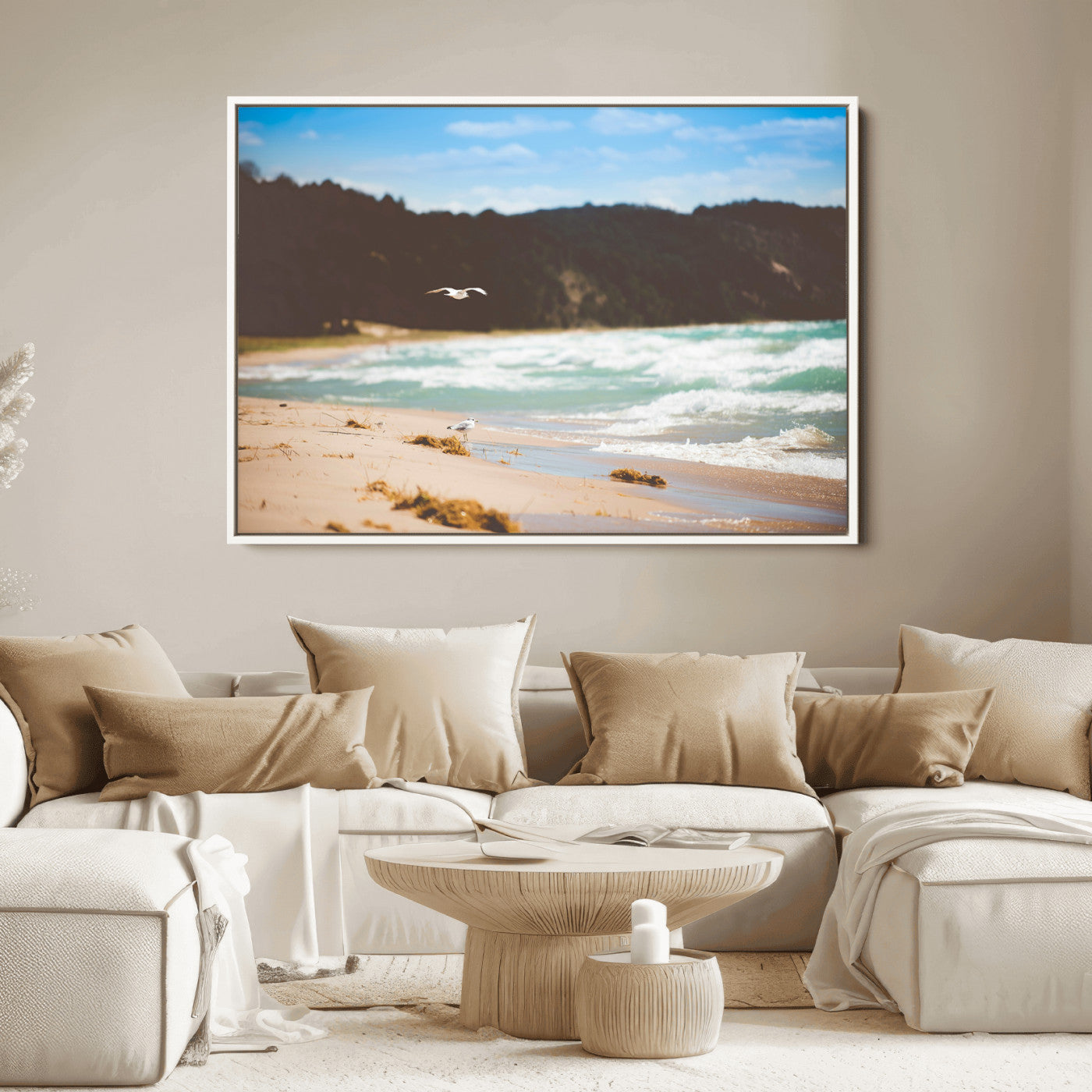 Serene beach scene with gentle ocean waves, sandy shore, and a seagull flying under a blue sky, perfect for coastal and nature-inspired decor.