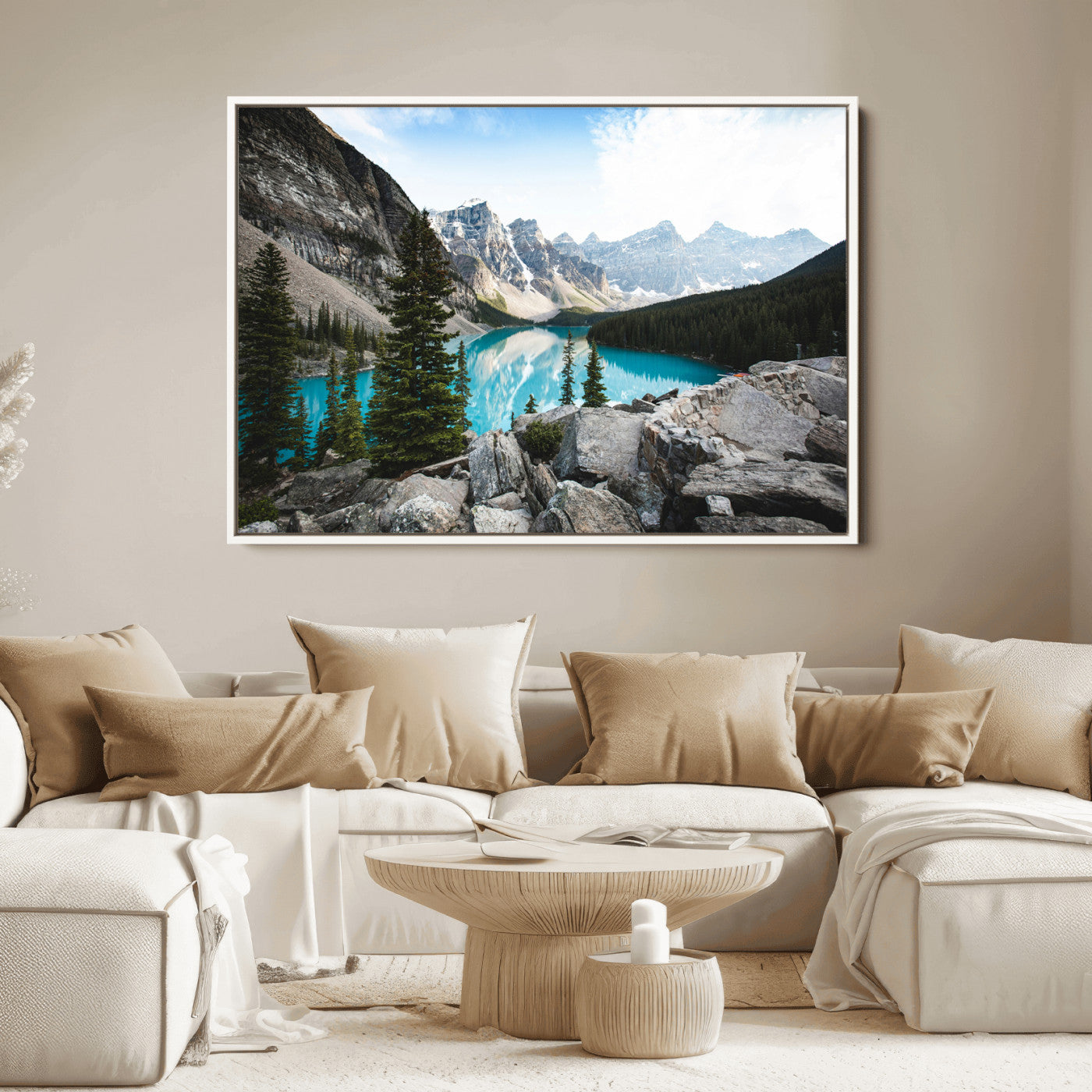 Stunning view of Moraine Lake with turquoise waters reflecting snow-capped mountains and evergreen trees, creating a peaceful alpine decor.