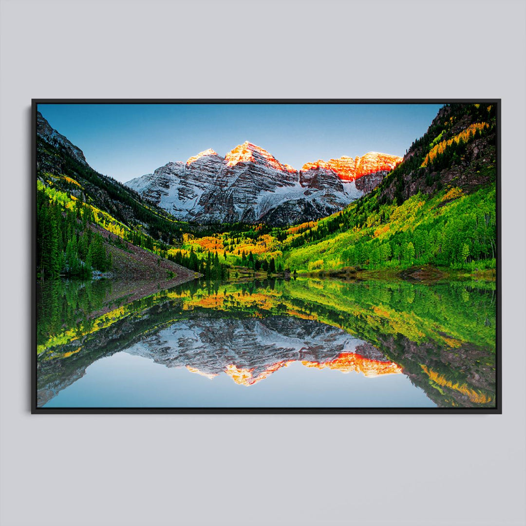 The Sunrise Maroon Bells Lake Wall Art Print beautifully captures North Maroon Peak mirrored in the tranquil lake, framed by lush greenery.