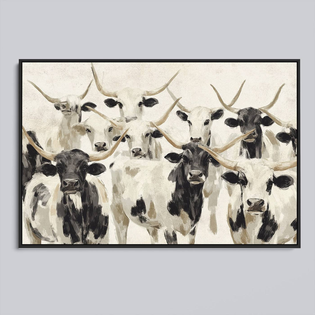 Canvas print titled Longhorn Texas Cow Drawing, depicting longhorn cattle with black and white markings, made in the USA, displayed on the wall.