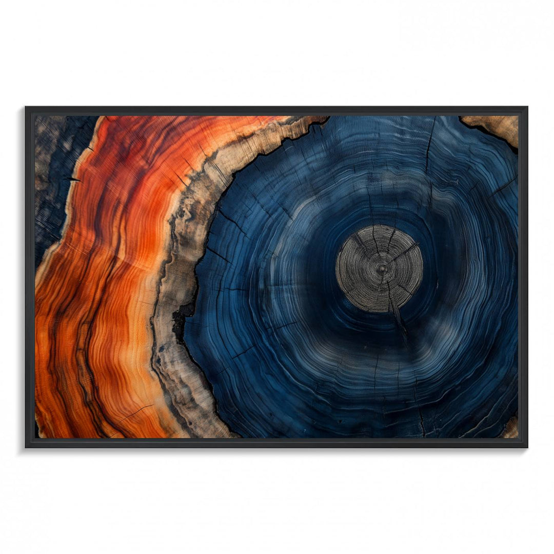 Abstract Tree Ring Wall Art Print on canvas featuring vibrant blue, orange, and brown rings with a natural rustic wood texture. Free shipping available!.