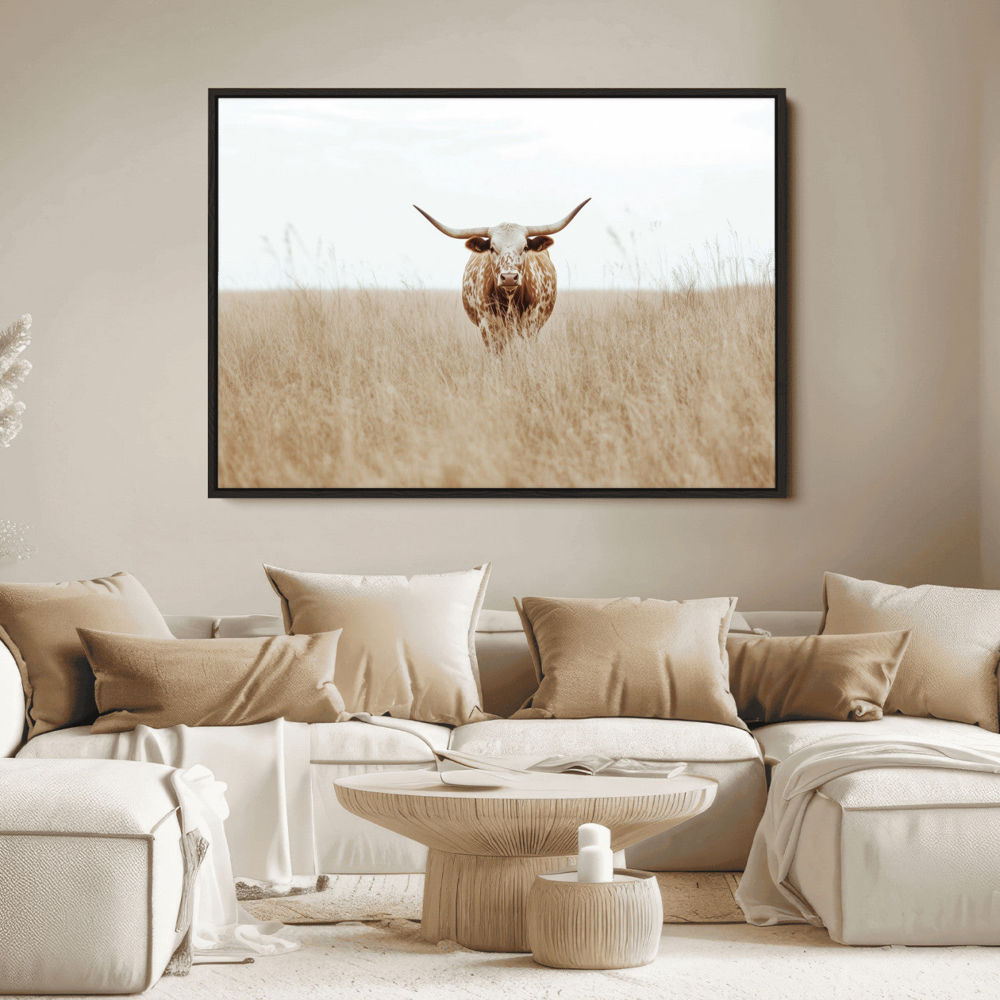 Texas Longhorn bull standing alone in dry grass with neutral tones, ideal for rustic western or cowboy-themed wall decor.