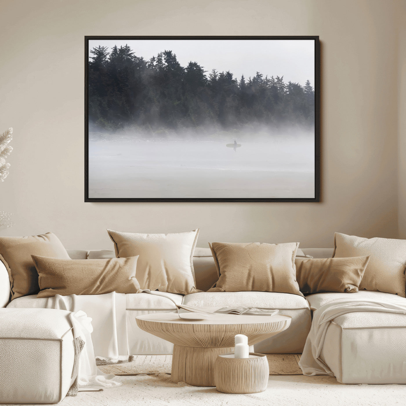 A lone surfer carrying a board through a misty shoreline, surrounded by dense trees and fog, creating a peaceful and mysterious coastal scene.