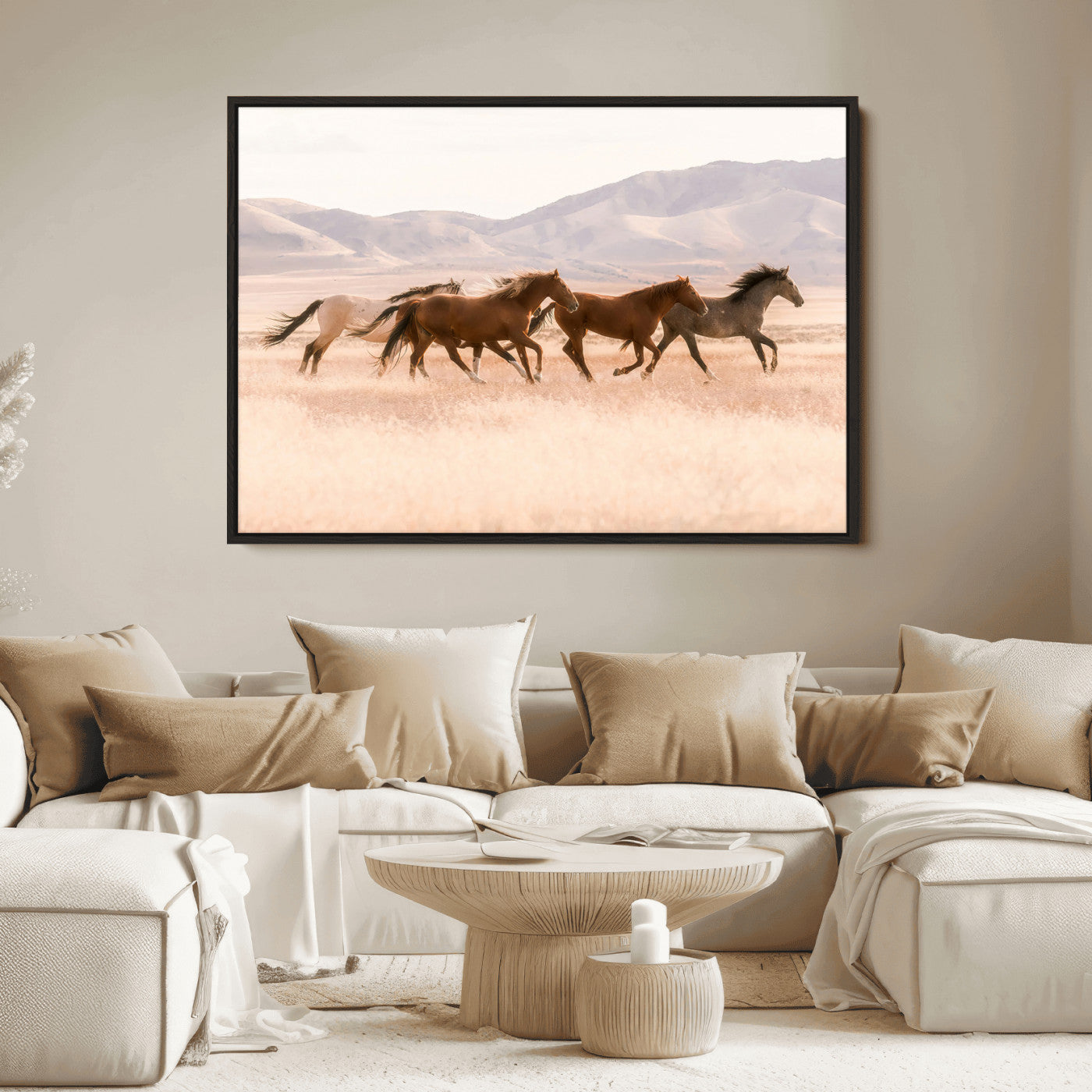 A herd of wild horses galloping through a sunlit desert plain with mountains in the background, perfect for rustic or western-themed wall decor.