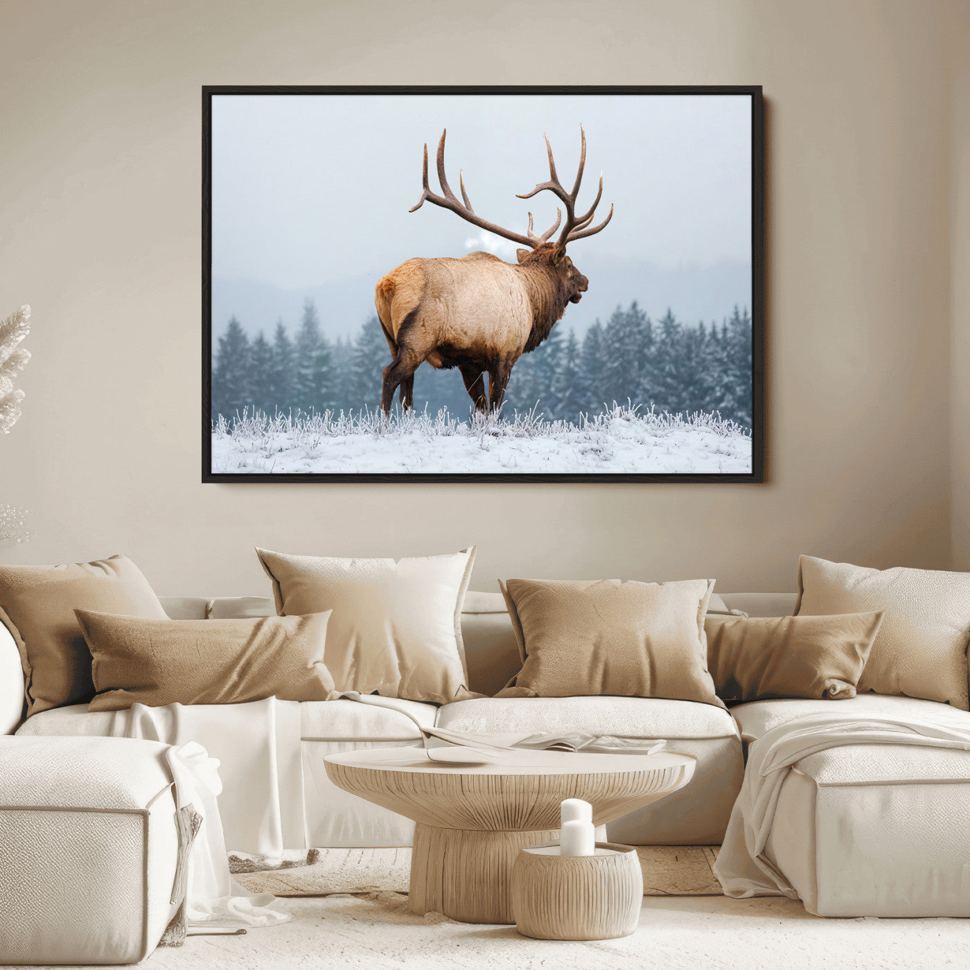 Large elk standing in a snowy field with pine trees in the background, ideal for rustic cabin or lodge-style wall decor.