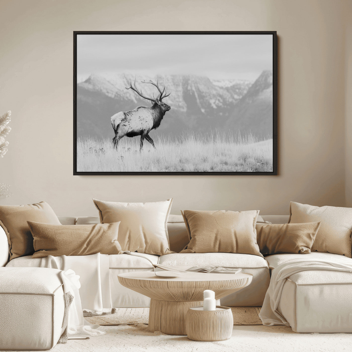 Black and white elk standing in front of snowy mountain range, perfect for rustic lodge or nature-inspired wall decor.