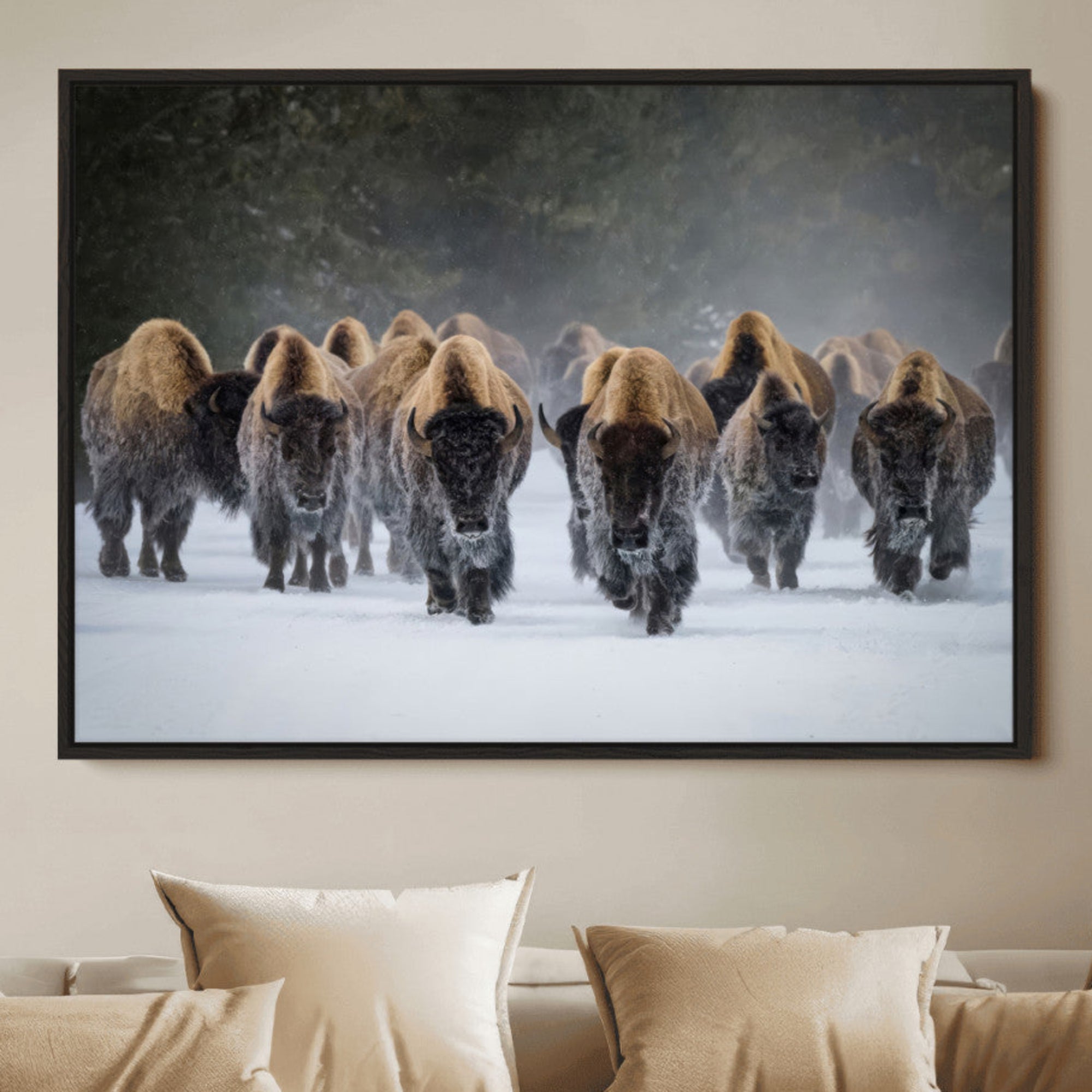 A herd of American bisons walking through deep snow in a forest, evoking a powerful rustic wilderness mood for western-style interiors.