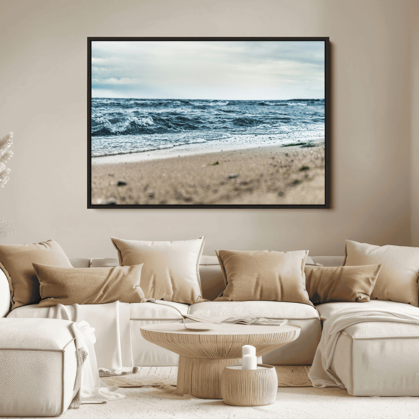 A moody ocean scene with gentle waves washing onto a sandy beach under a cloudy sky, creating a peaceful and coastal atmosphere.