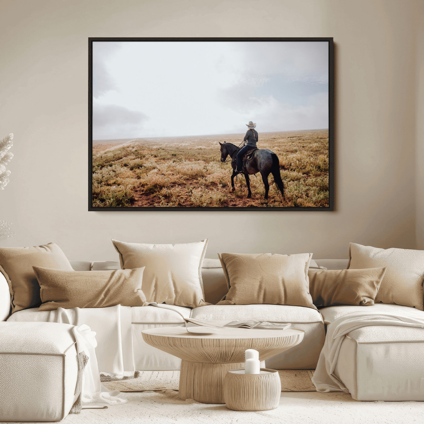 A lone cowboy riding horseback across an open prairie under a vast sky, capturing the rugged and timeless spirit of the Western frontier.
