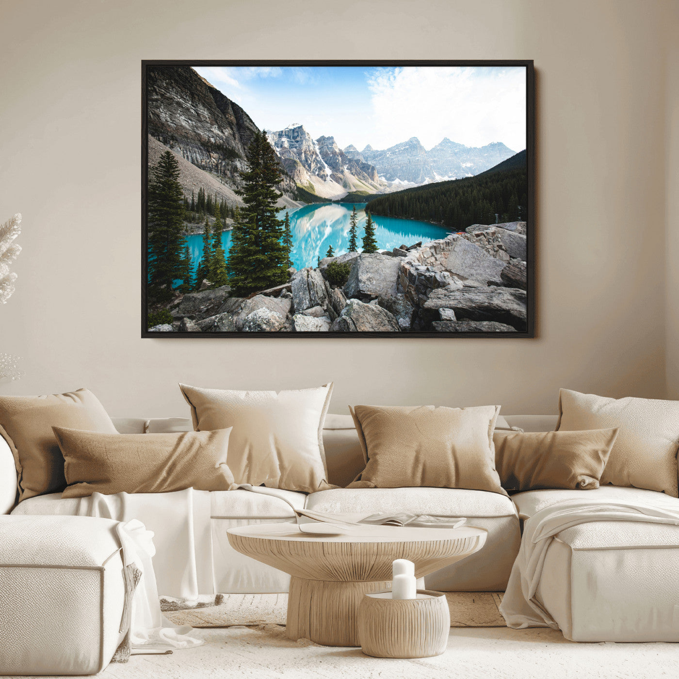 Stunning view of Moraine Lake with turquoise waters reflecting snow-capped mountains and evergreen trees, creating a peaceful alpine decor.