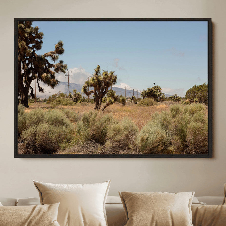 Scenic desert landscape with Joshua trees, dry grass, and distant mountains under a clear blue sky, perfect for southwestern and rustic decor.