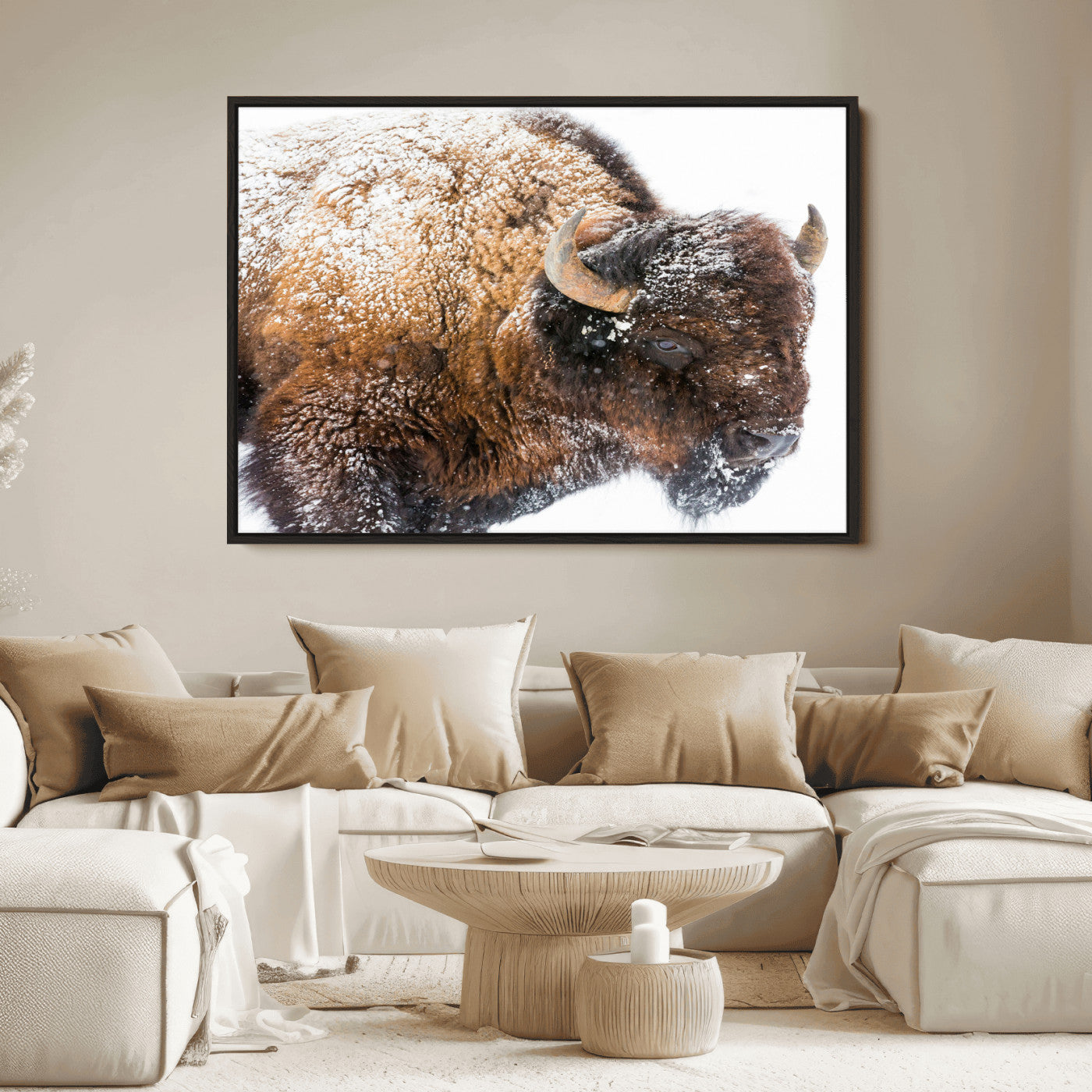Close-up photograph of a bison covered in snow, highlighting its thick fur and powerful presence, set against a white winter backdrop, ideal for rustic decor.