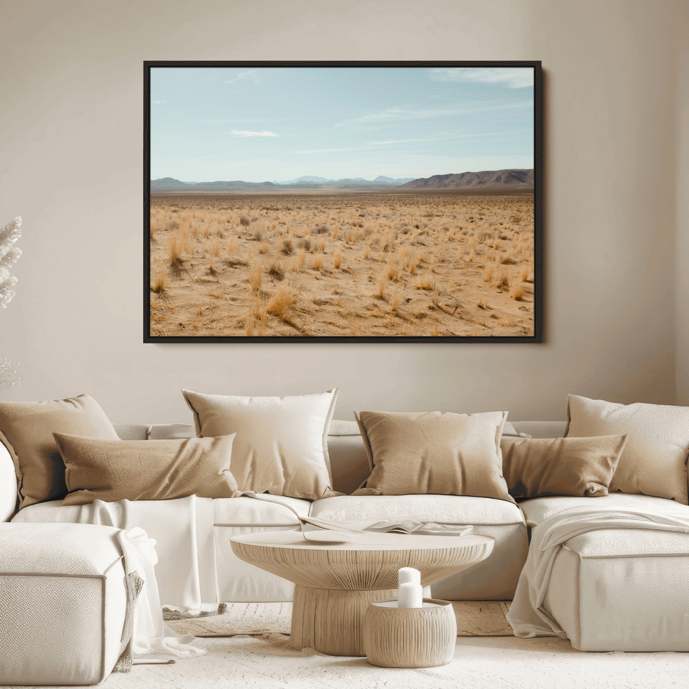 Expansive desert landscape with scattered dry grass and distant mountain range under a pale blue sky – Wall Art Canvas Print.