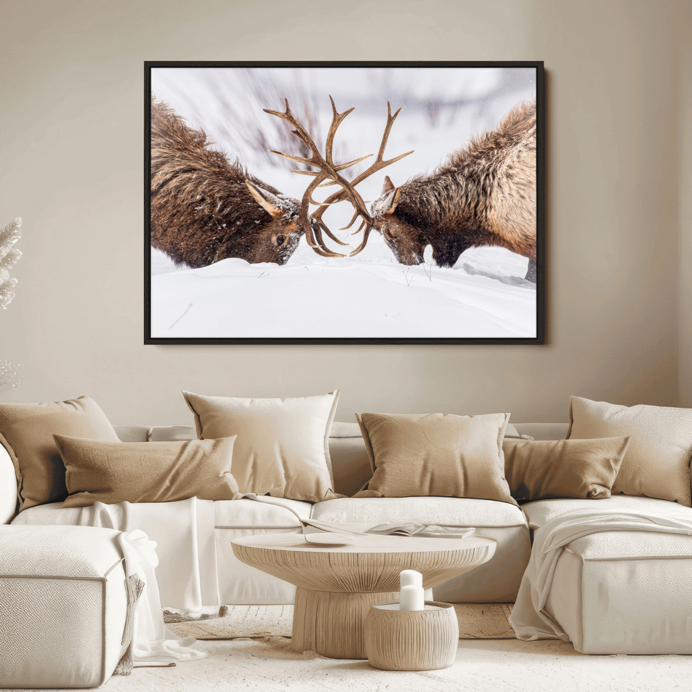 A dramatic wall art canvas print showcasing two majestic elk locking antlers in a snowy winter landscape, capturing the raw power and beauty of wildlife, ideal for nature-inspired home decor.