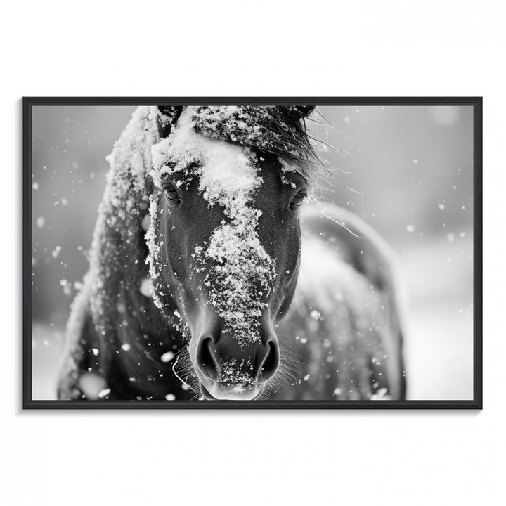 The Black and White Horse Winter Wall Art features a majestic horse with snow-covered hair set against a serene winter backdrop.