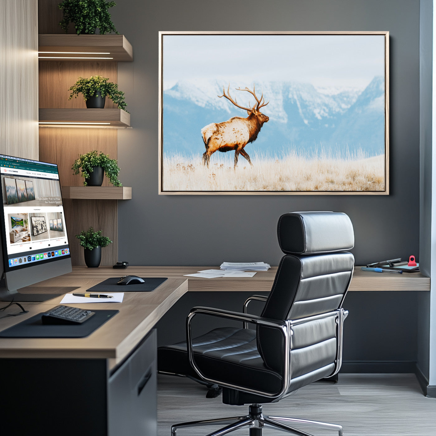 Majestic elk standing on dry grassland with snowy mountains in the background, ideal for rustic or lodge-inspired wall decor.