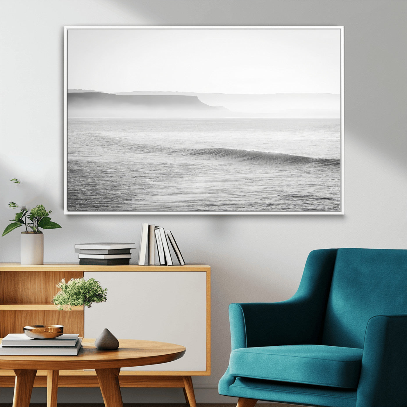 A black and white minimalist seascape featuring soft rolling waves and misty distant cliffs, creating a serene and timeless coastal atmosphere.