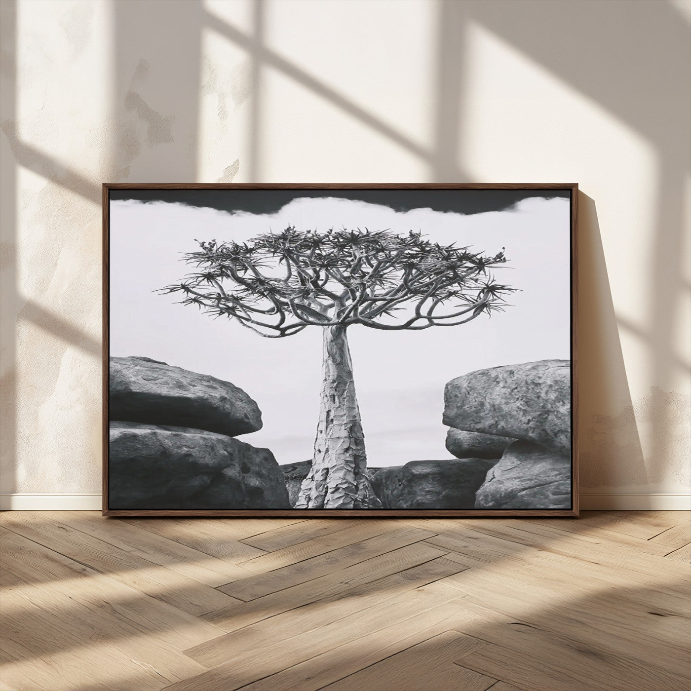 Black and white Joshua tree with bold rocky background, ideal for minimalist or desert-inspired home wall decoration.