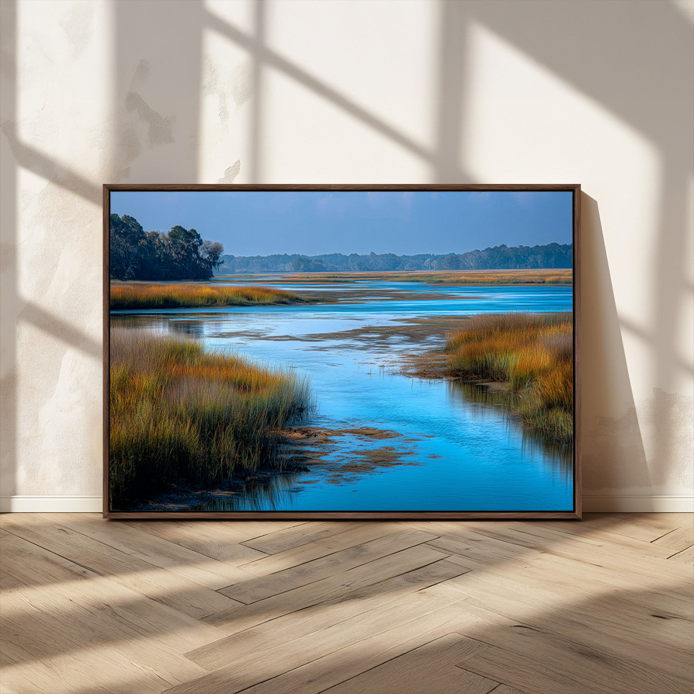 A peaceful marshland scene with calm blue water reflecting the surrounding grasses and trees, capturing the beauty of nature in a serene landscape.