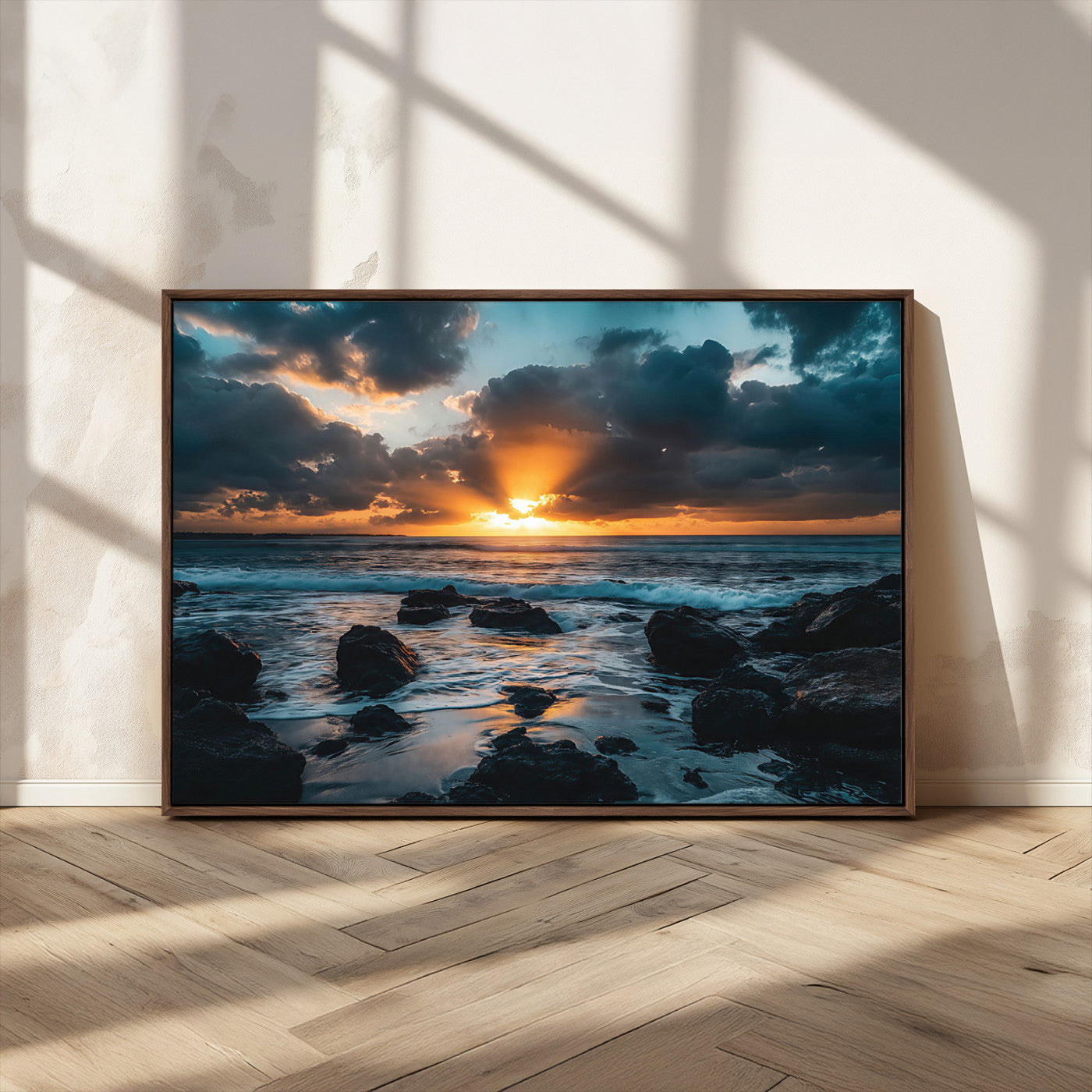 An awe-inspiring sunset over the ocean with rays of light piercing through dramatic clouds, creating a beautiful seascape with rocks in the foreground.