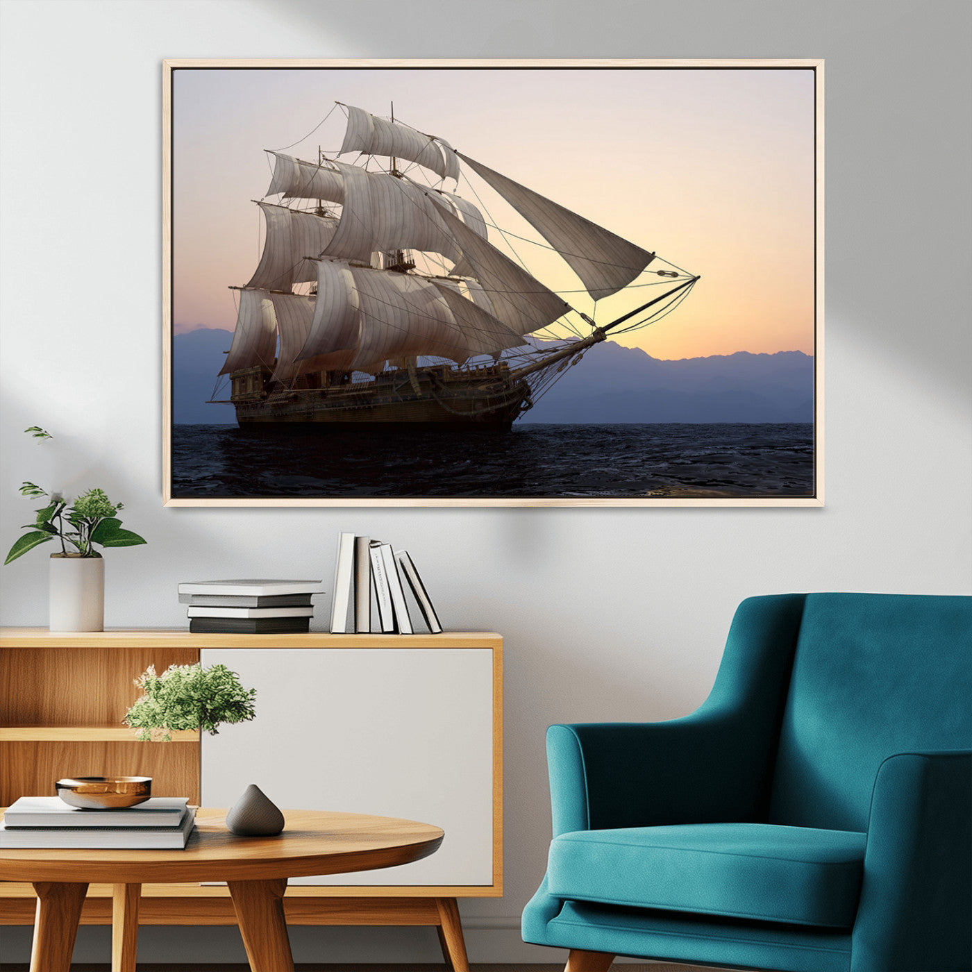 Majestic tall ship with full sails gliding across the ocean at sunset, with mountain silhouettes in the background – Wall Art Canvas Print.