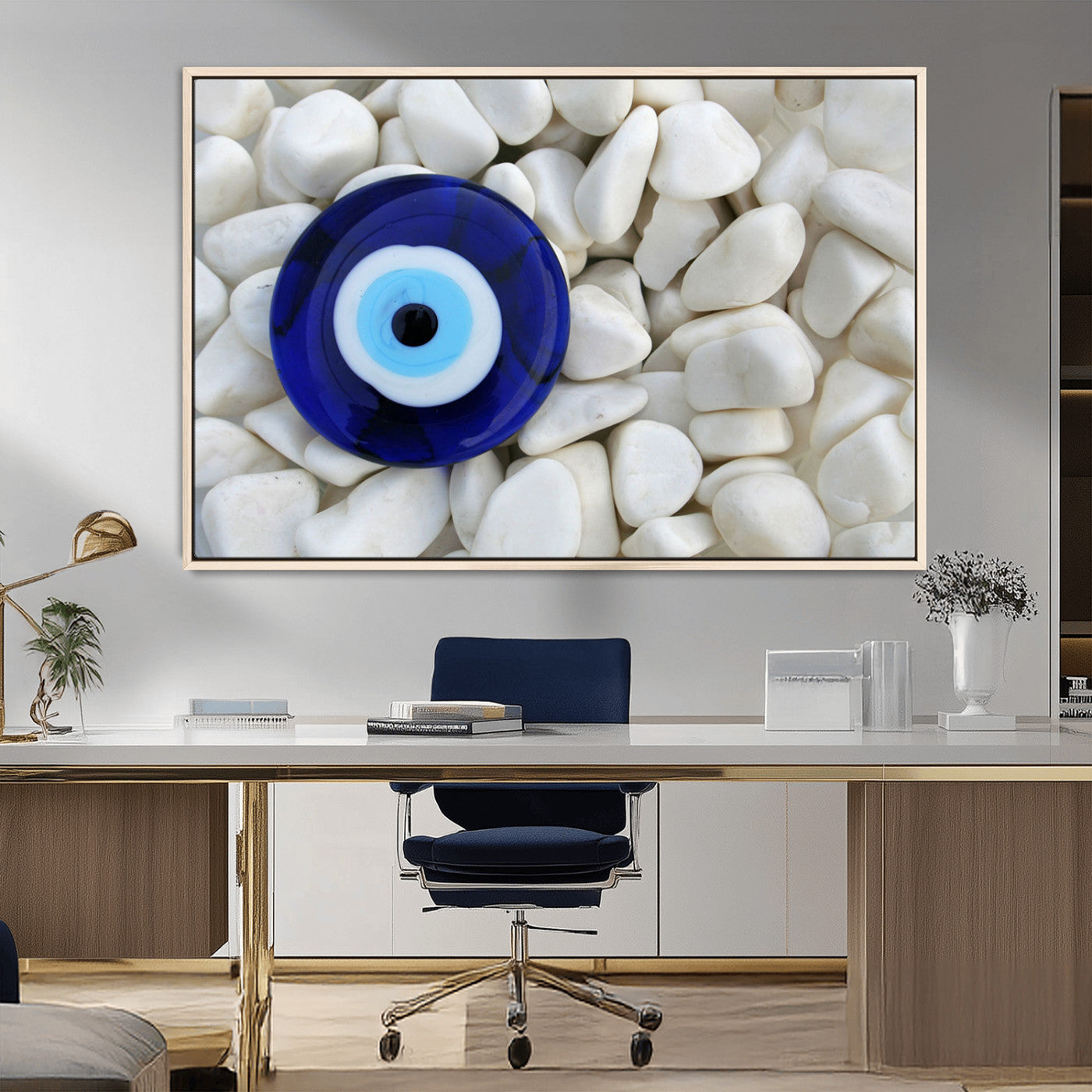 A close-up of a blue evil eye charm placed on white pebbles, symbolizing protection and good luck.