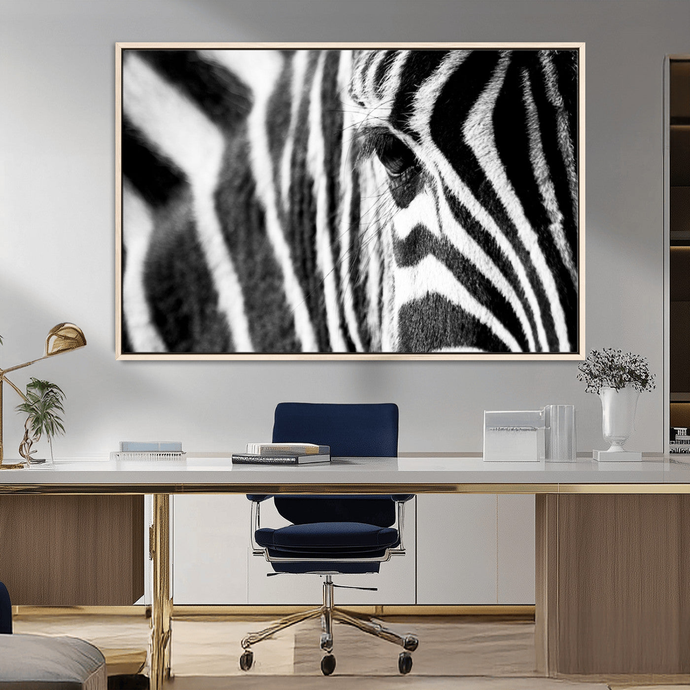 A close-up black and white photograph of a zebra's eye, showcasing the intricate patterns of its stripes in sharp detail.