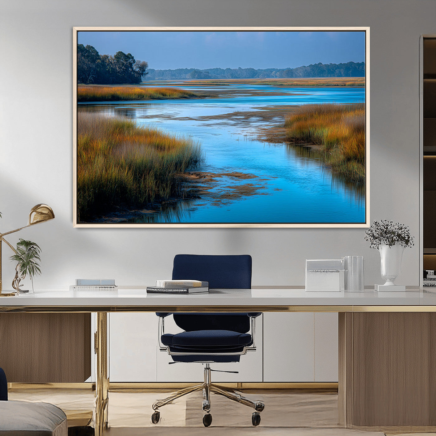 A peaceful marshland scene with calm blue water reflecting the surrounding grasses and trees, capturing the beauty of nature in a serene landscape.