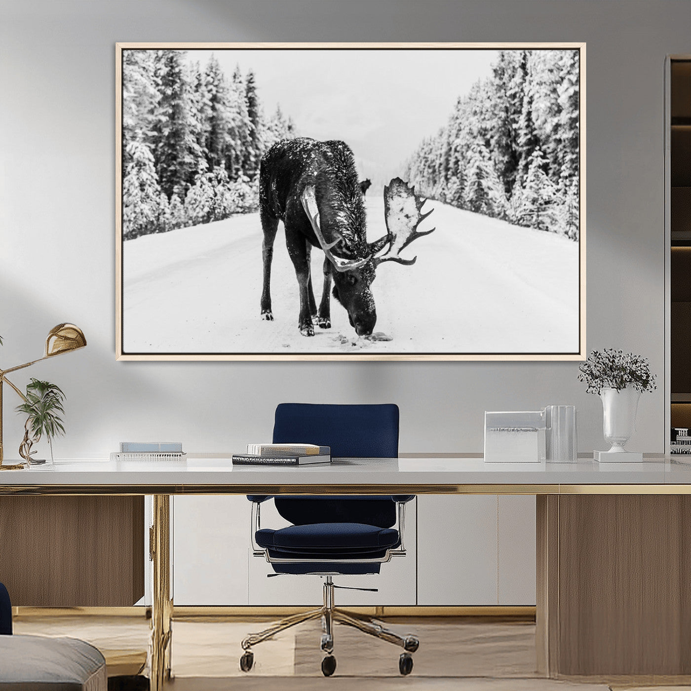 A majestic moose grazing in the snow-covered wilderness, surrounded by snow-covered trees, creating a peaceful winter scene.