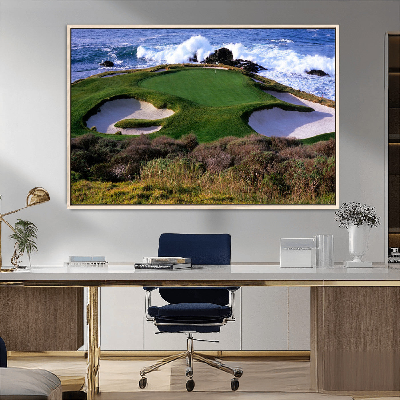 A scenic golf course located by the ocean, featuring a well-manicured green surrounded by sand traps and powerful ocean waves crashing on the shore.