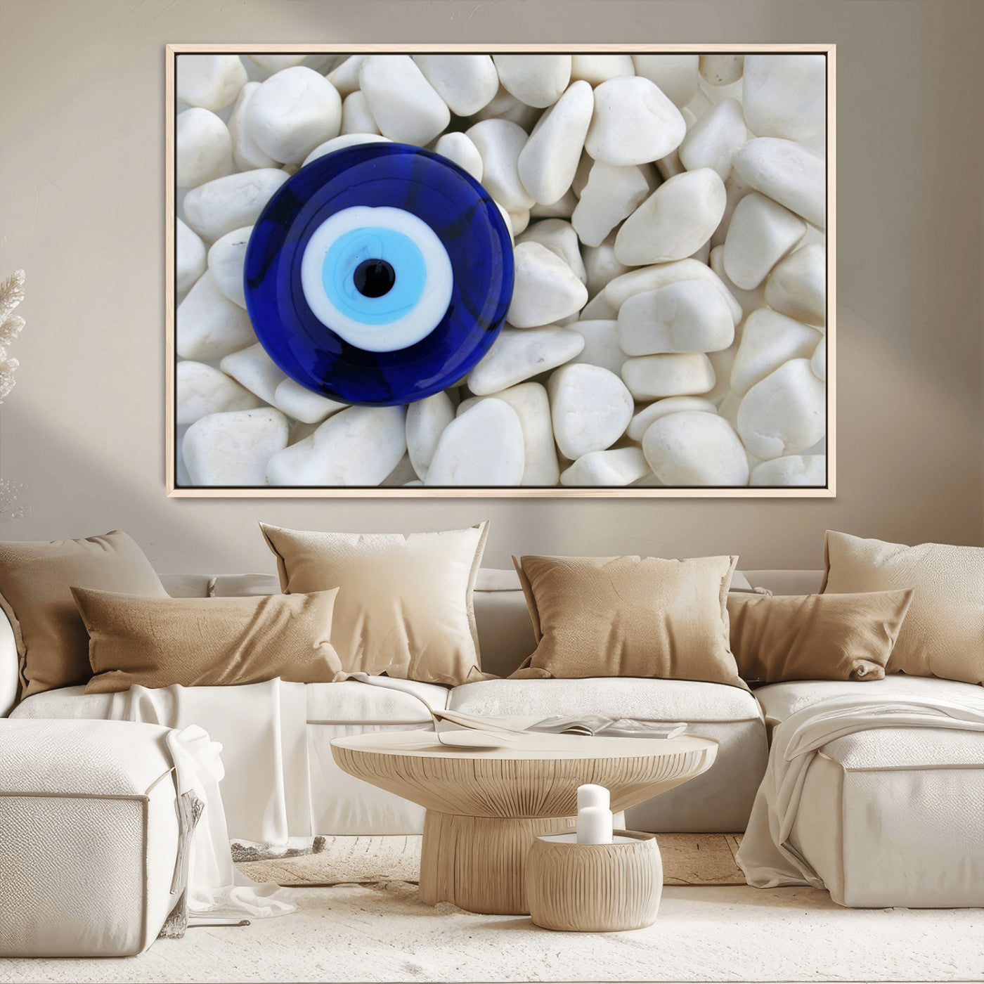 A close-up of a blue evil eye charm placed on white pebbles, symbolizing protection and good luck.