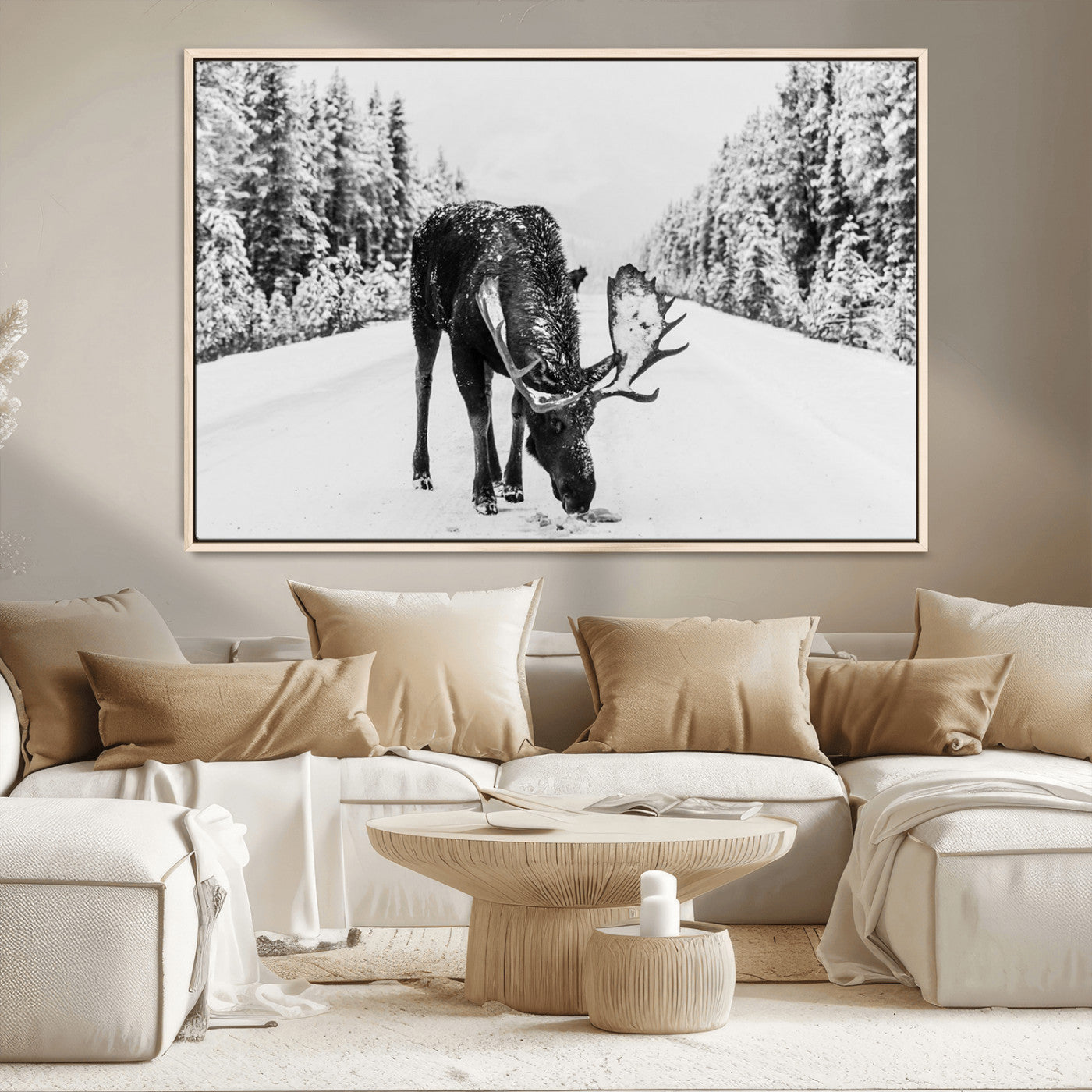 A majestic moose grazing in the snow-covered wilderness, surrounded by snow-covered trees, creating a peaceful winter scene.