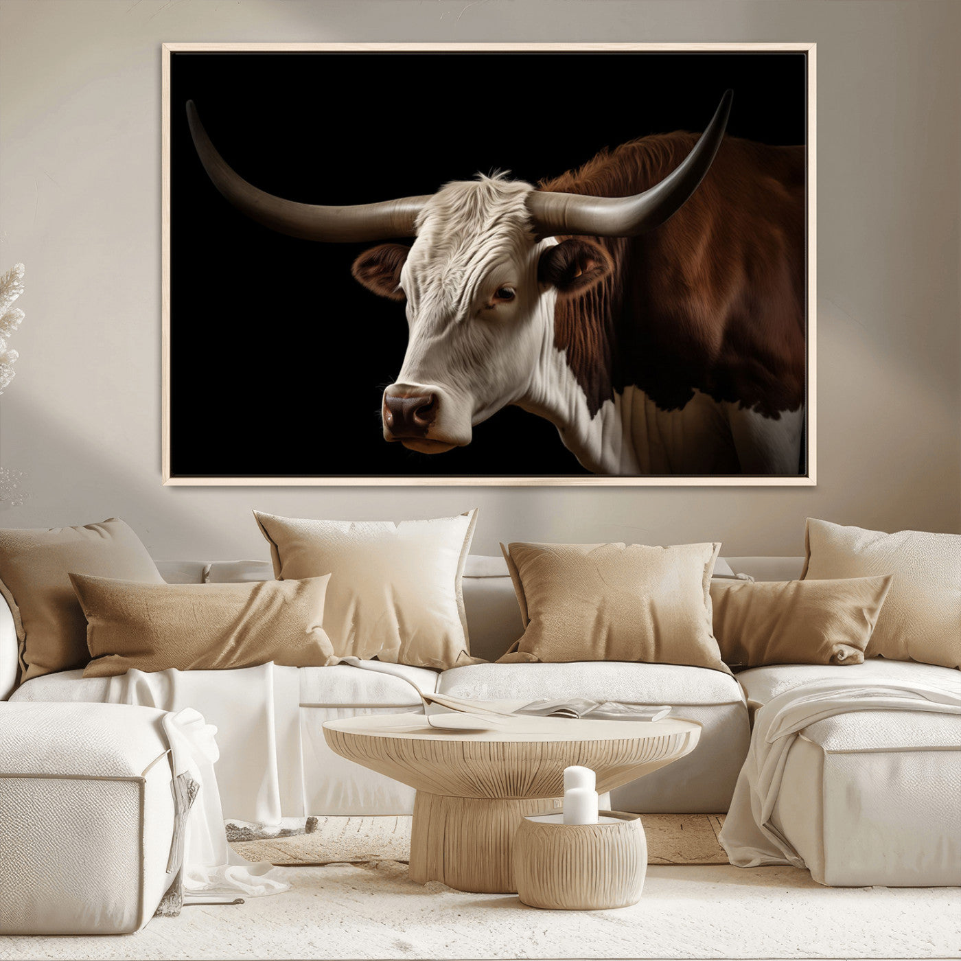 "Close-up of a brown and white longhorn cow with prominent curved horns against a black background."