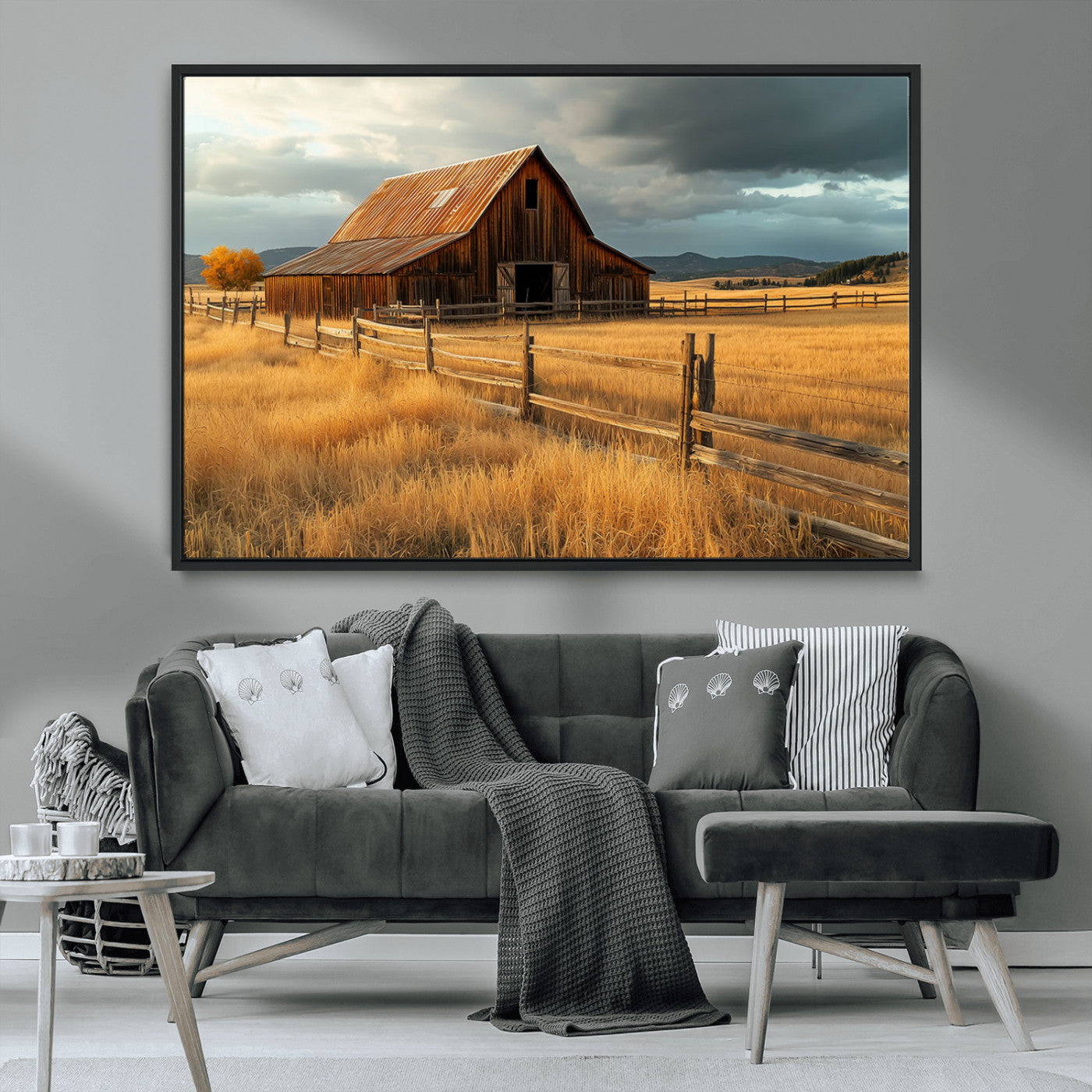"Golden fields surrounding a rustic barn with a weathered roof, a wooden fence, and dramatic skies with sunlight breaking through the clouds."