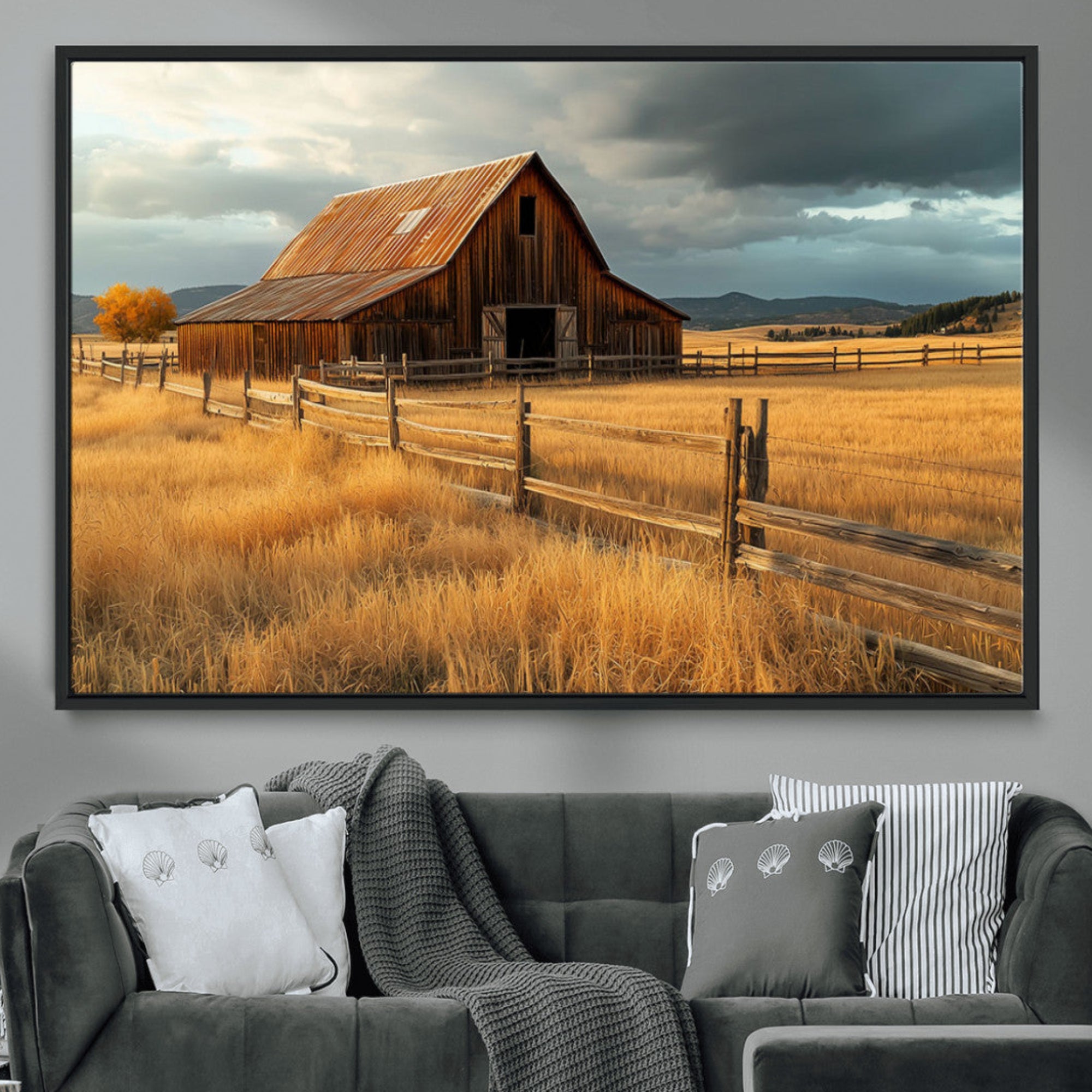 "Golden fields surrounding a rustic barn with a weathered roof, a wooden fence, and dramatic skies with sunlight breaking through the clouds."